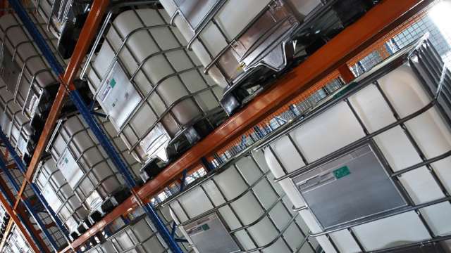 IBC tanks stacked in warehouse