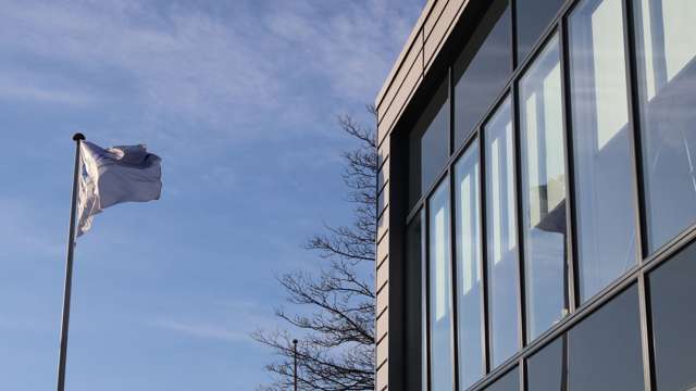 Flag in front of company headquarters